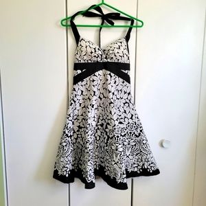 Black and white cocktail dress. Halter top with crinoline underneath. Size small